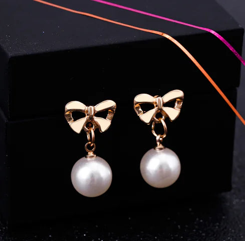 Pearl Drop Earrings with Bowknot Design